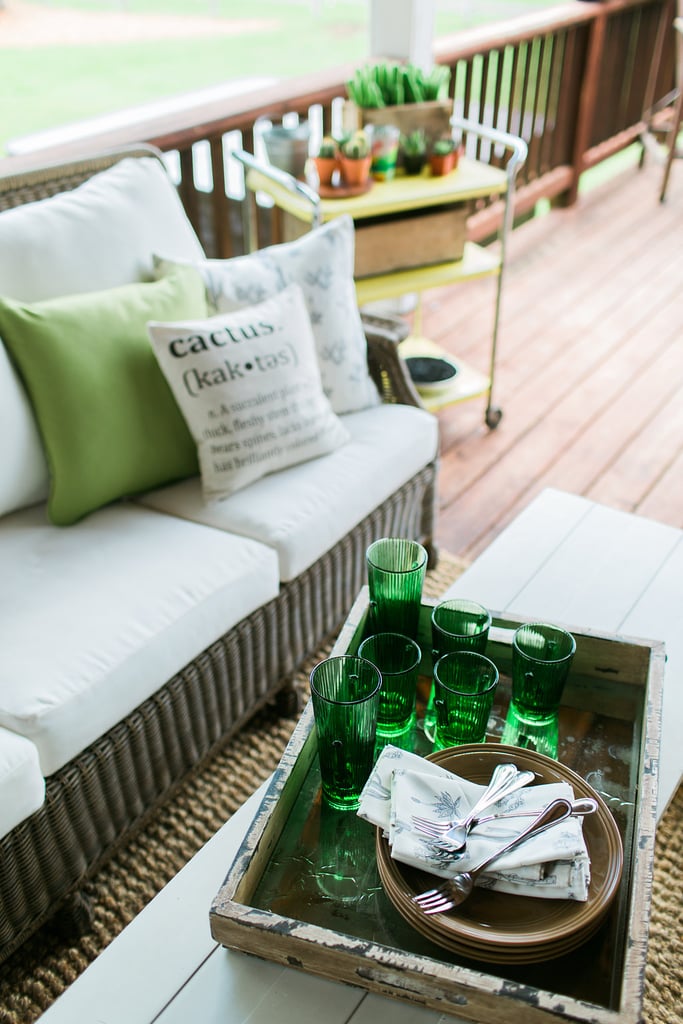 The porch was decorated with emerald-green cactus glasses, cactus-covered cloth napkins, and throw pillows from Minted and Etsy.