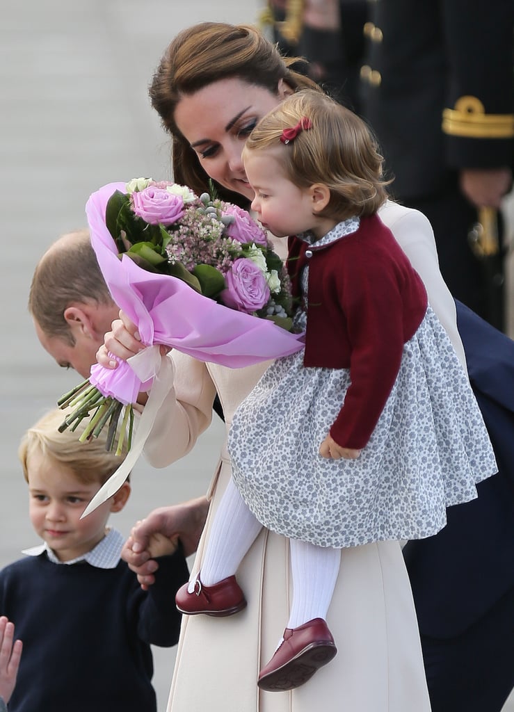 Princess Charlotte looked too cute while getting a whiff of some flowers in Victoria, British Columbia on Saturday. Before waving goodbye to well-wishers and boarding a sea plane that would take them home to England, the tiniest royal and her mum, the Duchess of Cambridge, were presented with a bouquet by a young boy. After shaking his hand and accepting the flowers, Kate let her 1-year-old get a sniff. Charlotte looked to be both amused by and curious about the pretty roses. The royal family wrapped up their time in Canada after a whirlwind eight days of events. Charlotte and her 3-year-old brother, Prince George, were also able to get in on the fun when they attended a children's party for military families last week, and we scoped out lots of similarities between Charlotte and George's first official tours. 

    Related:

            
                            
                    27 Times Princess Charlotte Snatched the Spotlight in Canada Without Even Trying
                
                            
                    16 Duchess of Cambridge Mum Moments That Will Melt Your Heart