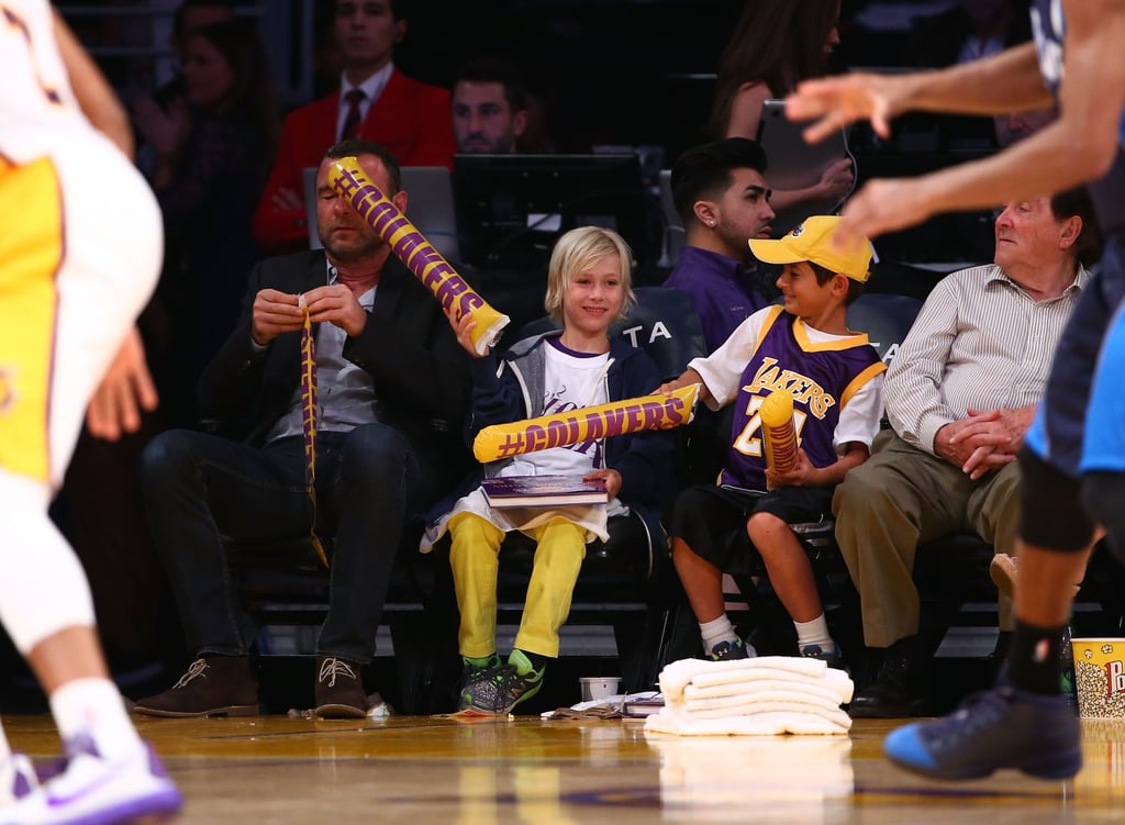 Liev Schreiber got a light smack when he took his son Sasha and a pal to the LA Lakers and Dallas Mavericks game on Sunday.