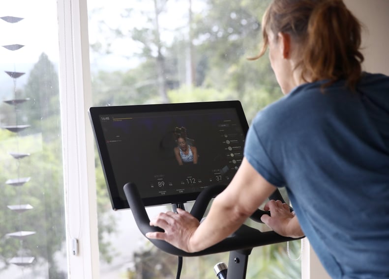 SAN ANSELMO, CALIFORNIA - APRIL 06:  Becky Friese Rodskog rides her Peloton exercise bike at her home on April 06, 2020 in San Anselmo, California.  More people are turning to Peloton due to shelter-in-place orders because of the coronavirus (COVID-19). T