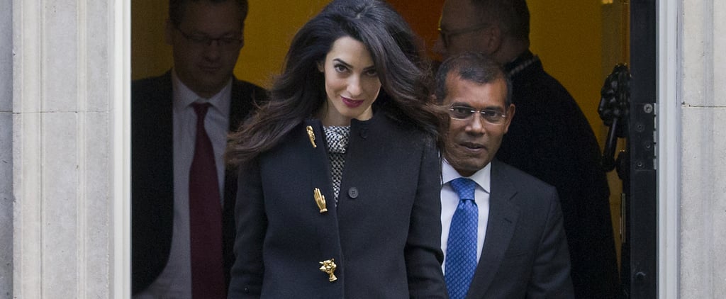 Amal Clooney Wearing a Black Coat With Gold Buttons