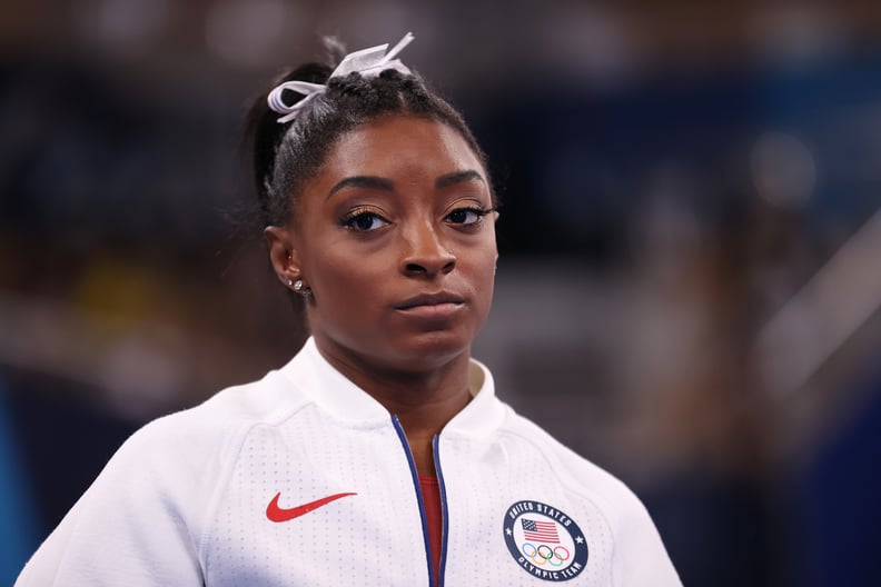 TOKYO, JAPAN - JULY 27: Simone Biles of Team United States looks on during the Women's Team Final on day four of the Tokyo 2020 Olympic Games at Ariake Gymnastics Centre on July 27, 2021 in Tokyo, Japan. (Photo by Laurence Griffiths/Getty Images)