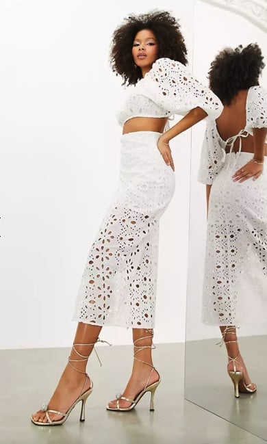 Asos's Drape Front Broderie Midi Skirt in White (£64, originally £85).