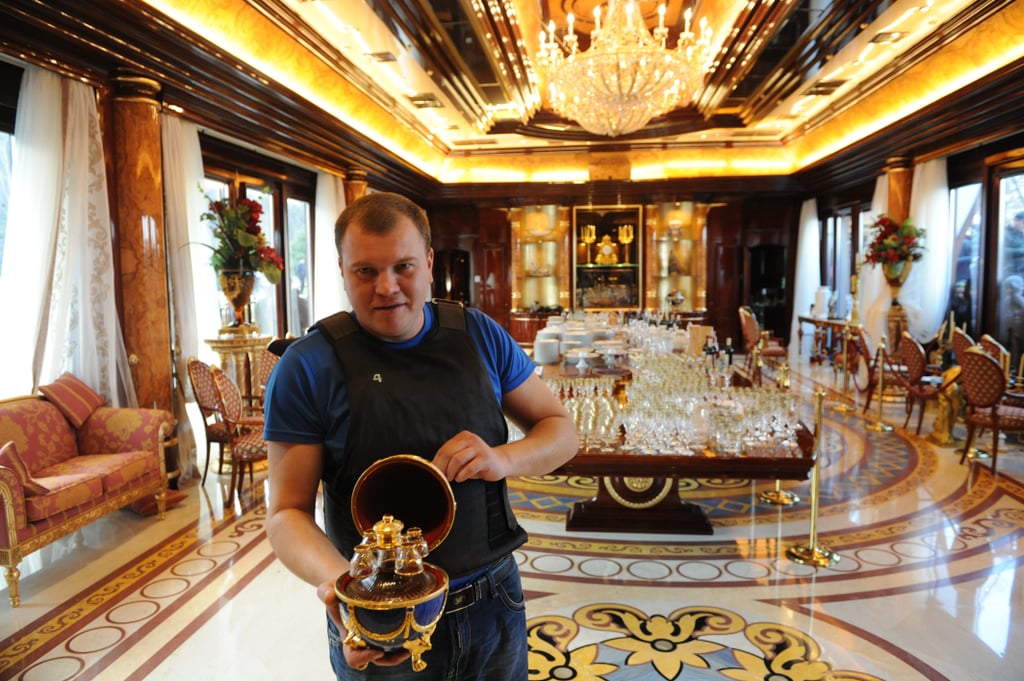 Another protester held up one of the ornate pieces inside the house.