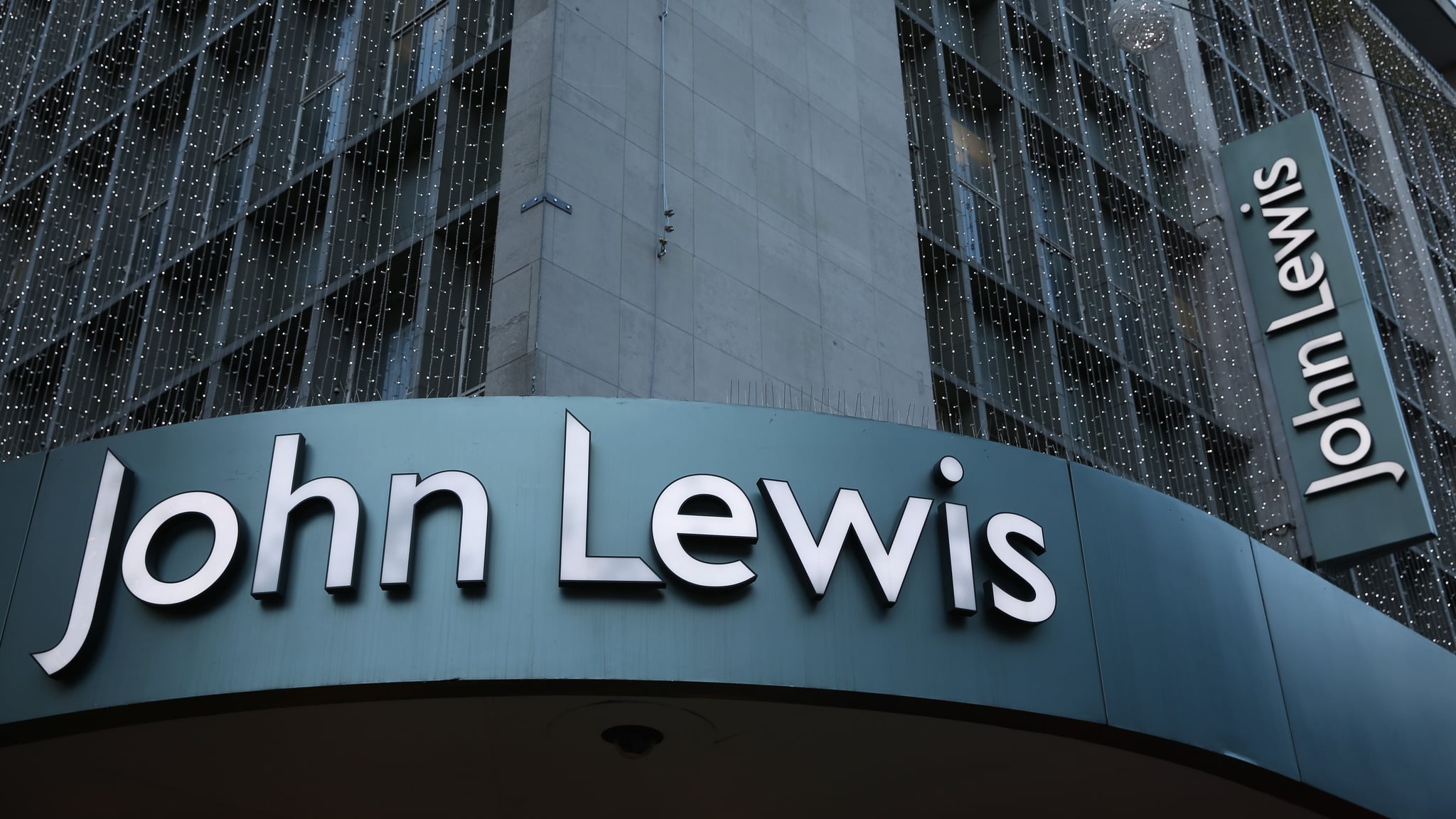 LONDON, UNITED KINGDOM - JANUARY 02:  The sign for the flagship branch of the John Lewis department store in Oxford Street on January 2, 2014 in London, England. Department stores House of Fraser and John Lewis have announced they experienced good trading over Christmas while shares in Debenhams have fallen following the company's poor sales during the same period.  (Photo by Oli Scarff/Getty Images)