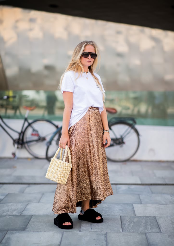 Half-tuck a t-shirt into a maxiskirt and finish with a beaded bag and slides for easy chic.