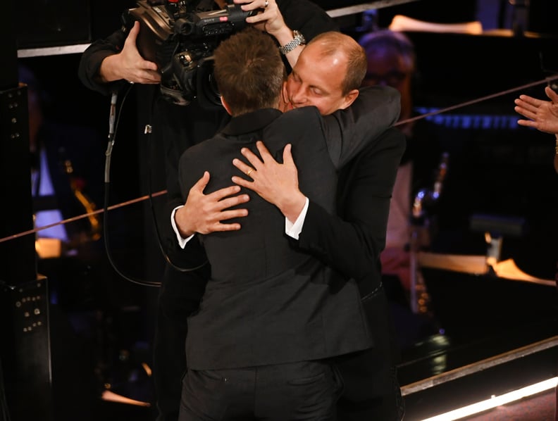 Woody Harrelson hugged his Three Billboards costar and best supporting actor winner Sam Rockwell.