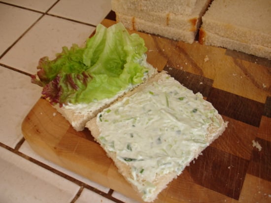 Lay the lettuce flat between the two pieces of bread