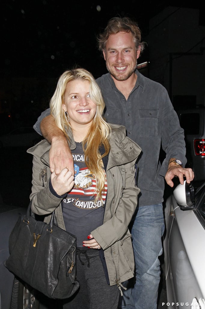 Eric kept his arm around pregnant Jessica as they left an LA restaurant in November 2011.