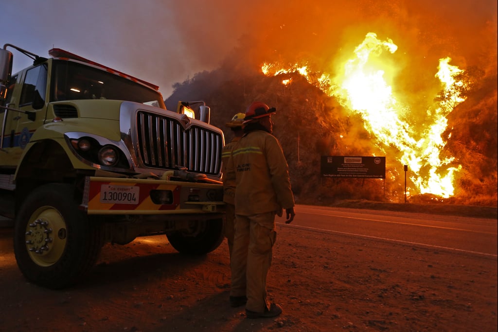 Firefighters monitored the flames on its second day burning.