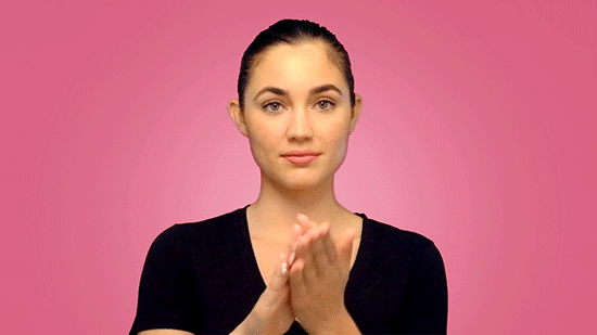 woman exfoliating her face gif