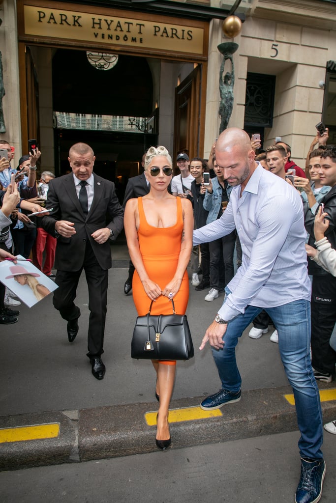 Lady Gaga Doesn't Need Help Walking in Heels, but He's There to Offer It Anyways