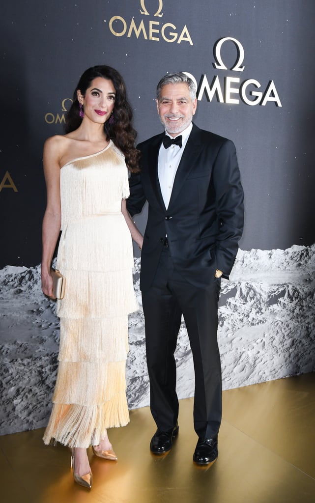 This asymmetric Oscar de la Renta dress is very '20s flapper. Amal really glows in champagne, plus the fringed fabric moves so beautifully while you walk.
Click here for more fashion features, interviews, and tips.