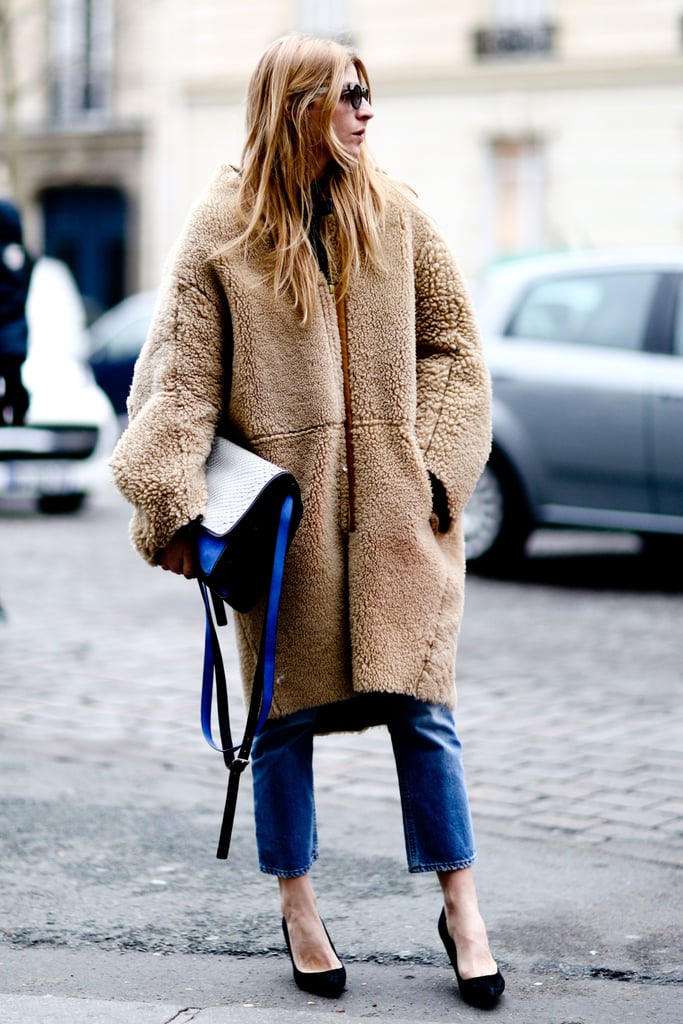 This fuzzy coat got a chic makeunder with a colorblock bag, slim denim, and classic pumps.