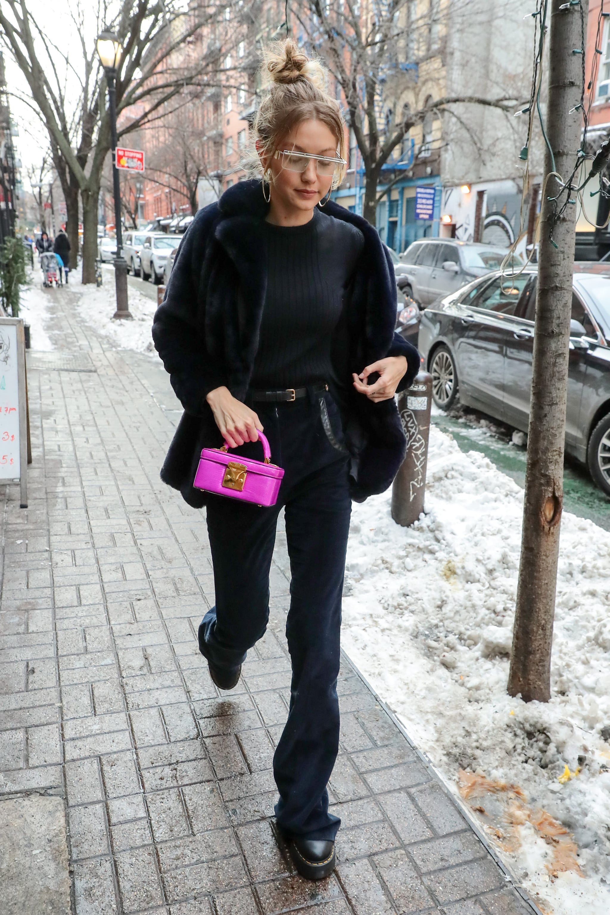 A little pop of pink from her Stalvey handbag brightened up Gigi's, 25  Stylish Outfits That Prove 2018 Is Gigi Hadid's Year to Shine