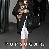 Miranda Kerr was on-trend in a black and white ensemble while out in NYC. She started with a white knee-length dress, then added a black coat, her favorite Givenchy bag, and black pointy pumps.