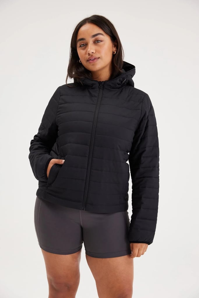 A Down Jacket: Girlfriend Collective Hooded Packable Puffer