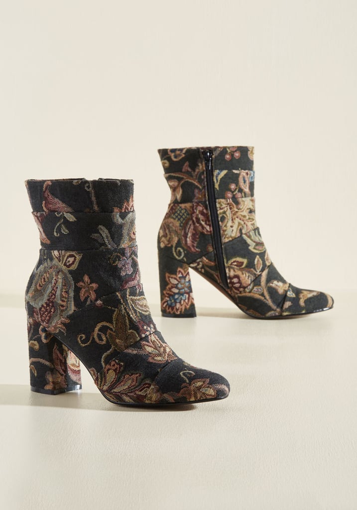 Tapestry Boots ($159)
Bring in an additional layer of pattern with a pair of vintage-inspired brocade boots. It's a bold move, but one that will make your look stand out. By sticking to a classic block-heel silhouette and ensuring the colors mirror those on the blouse, your outfit will look streamlined as opposed to busy.
