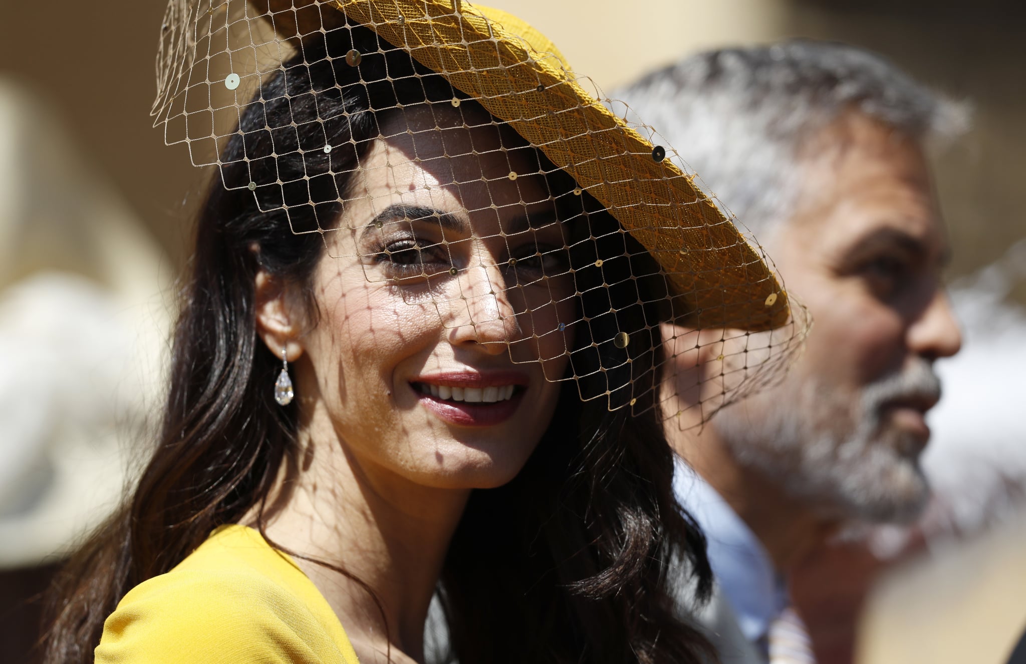 WINDSOR, UNITED KINGDOM - MAY 19:  Amal Clooney and George Clooney arrive at St George's Chapel at Windsor Castle for the wedding of Prince Harry and Meghan Markle on May 19, 2018 in Windsor, England. (Photo by Alastair Grant - WPA Pool/Getty Images)