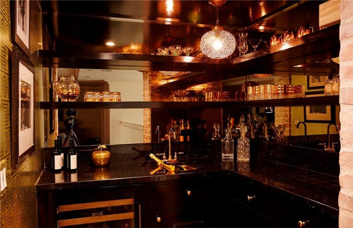 The midcentury-inspired wet bar is dark and sexy. We wonder if any of Lauren's castmates from The Hills have imbibed here.