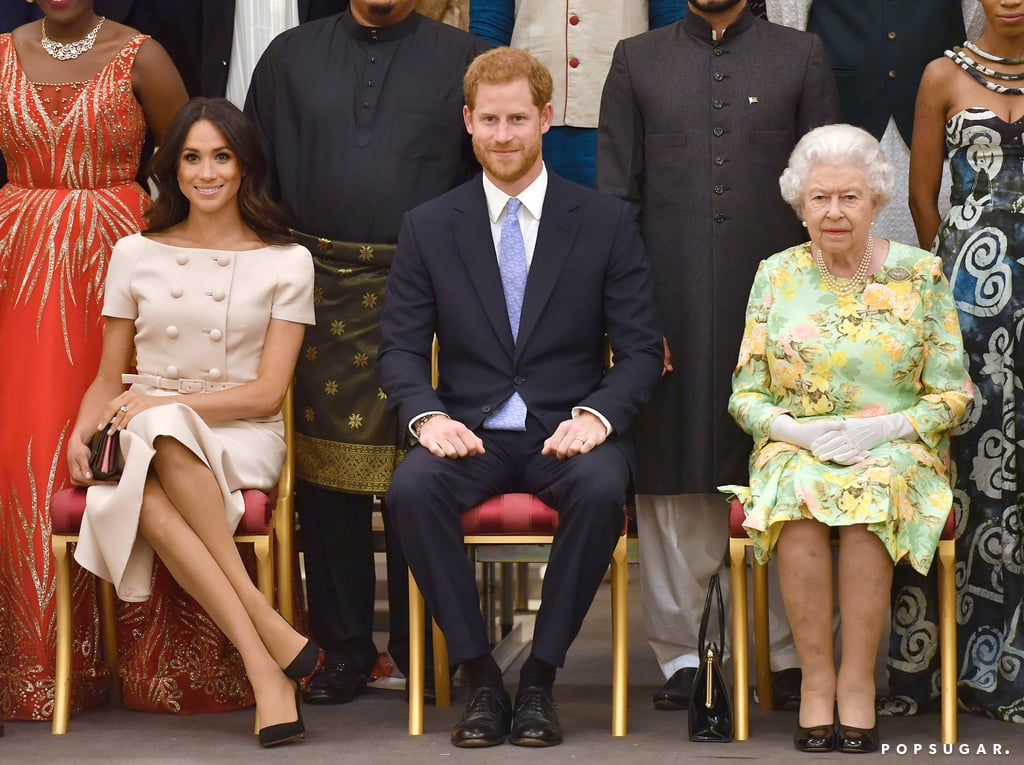 Fresh from their flawless appearance at Royal Ascot, the Duke and Duchess of Sussex had their next big royal duty on Tuesday evening, when they attended the Queen's Young Leaders Awards at Buckingham Palace to celebrate a group of young leaders from across the world. Queen Elizabeth II was the official host of the event, which brought out a handful of famous faces, including David Beckham, but she called on her grandson and his new wife for support. Harry cut a suave figure in a navy suit, while Meghan gave off major Jackie O vibes in a pink double-breasted dress and bow-adorned heels.
The queen recently named Harry her Commonwealth Youth Ambassador, and he confirmed at the time that Meghan would be by his side as he undertook this role. Tuesday's appearance was evidence of this, and no doubt one of many similar events to come in the next few years. 
Both Harry and Meghan are strong supporters of youth initiatives, and many of their early appearances as a couple were in support of charities and campaigns that help young people. Their first appearance of 2018 was a visit to a youth radio station, and who can forget their cute encounter with a group of kids in Birmingham? See how they fared on their latest appearance now, then find out where they're headed next.

    Related:

            
            
                                    
                            

            What a Year It&apos;s Been! 23 Major Royal Milestones Prince Harry and Meghan Markle Hit in 2018