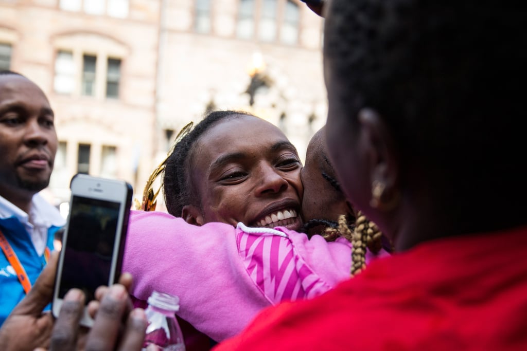 Rita Jeptoo hugged her family after winning the women's division of the Boston Marathon.