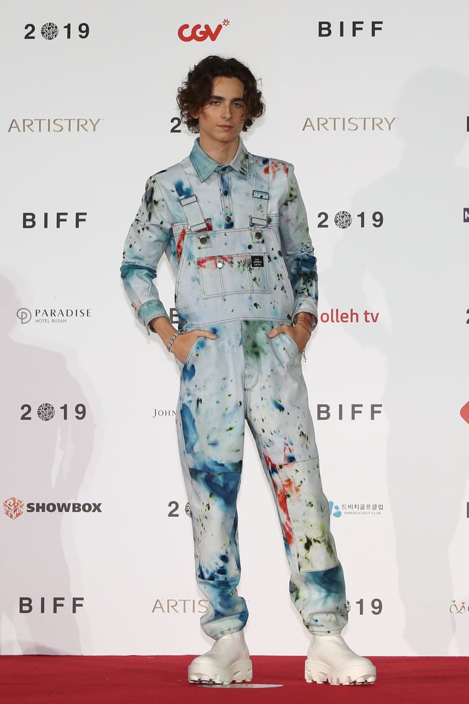 At the 2019 Busan International Film Festival, Timothée boldly wore matching, paint-splattered overalls and a shirt by artist Sterling Ruby.