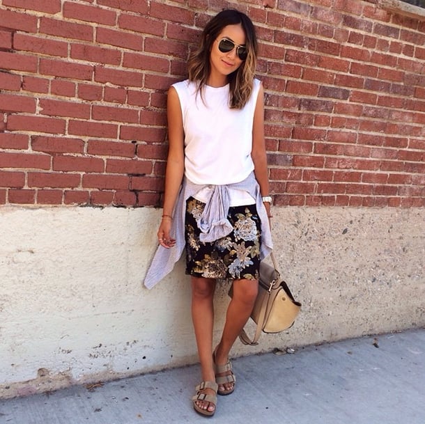 A standard, neutral-colored button-down and slides break up an outfit that otherwise feels a bit expected, bringing on a casual, weekend-ready vibe.
Source: Instagram user sincerelyjules