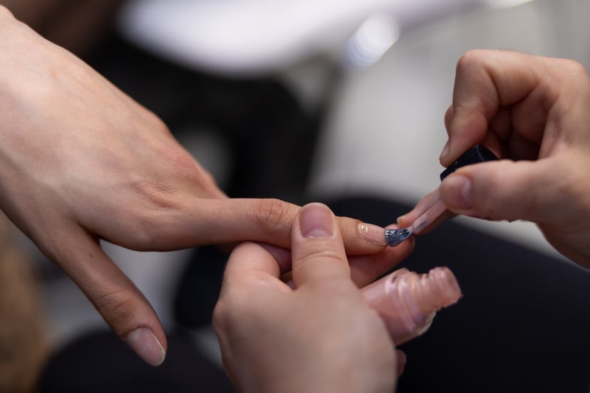 PARIS, FRANCE - OCTOBER 03: (EDITORIAL USE ONLY - For Non-Editorial use please seek approval from Fashion House) A model gets nails done in the backstage prior to the Germanier Womenswear Spring/Summer 2023 show as part of Paris Fashion Week on October 03