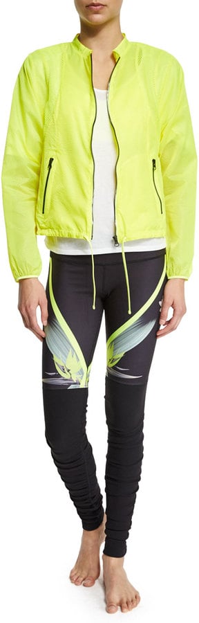 Try layering your tank with a lightweight jacket, like this one.
Alo Yoga Sunset Nylon Jacket W/ Mesh Inset, Highlighter ($68, originally $98)