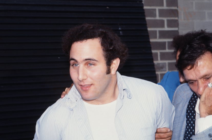 Police officers escort American accused (and ultimately convicted) serial killer David Berkowitz (left), known as the Son of Sam, into the 84th precinct station, New York, New York, August 10, 1977. (Photo by Robert R. McElroy/Getty Images)