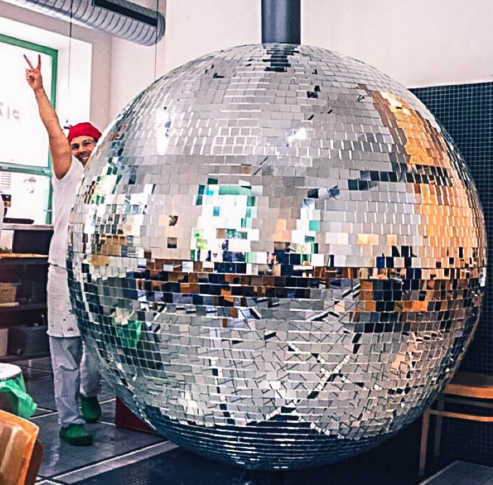 All the pizzas are baked to perfection in a spinning oven shaped like a gigantic disco ball!