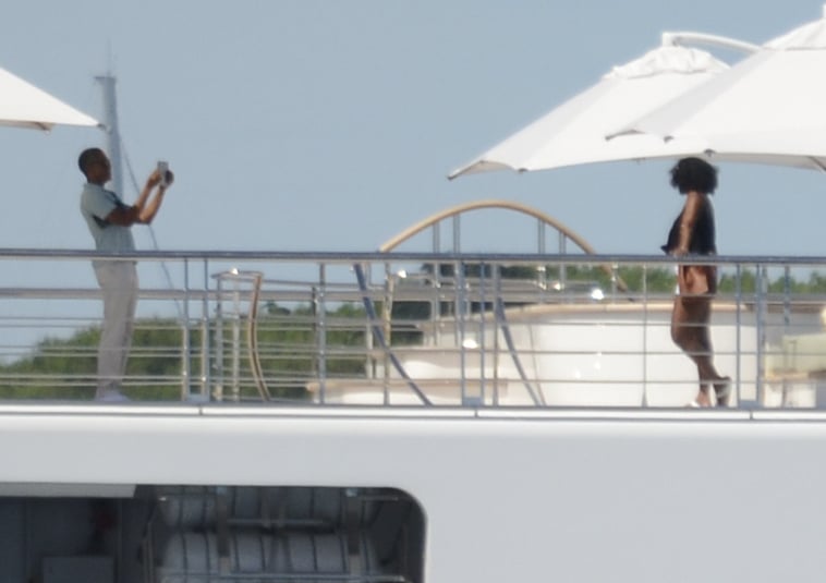 April 14: Michelle Strikes a Pose For Barack on a Yacht in Tahiti