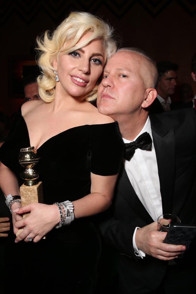 Lady Gaga posed with American Horror Story creator Ryan Murphy and her shiny new award for best actress.