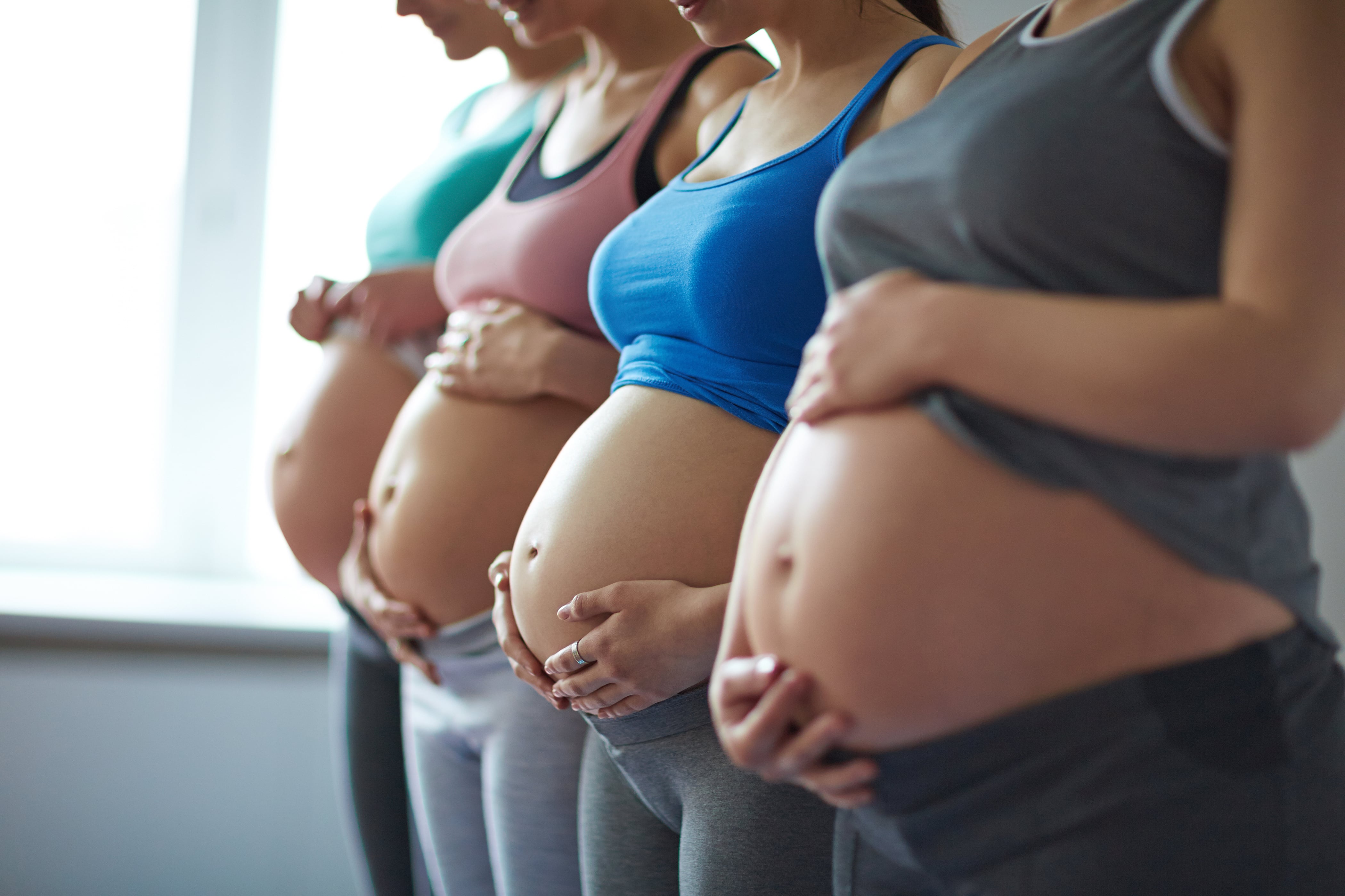 Mum who is nine months' pregnant practises extreme yoga which sees