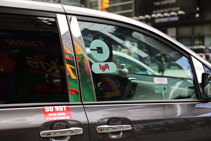 NEW YORK, NY - JULY 30:  A Lyft ride hailing vehicle moves through traffic in Manhattan on July 30, 2018 in New York City. After a significant increase in local traffic and a spate of suicides by taxi drivers, New York City is planning to vote on capping 