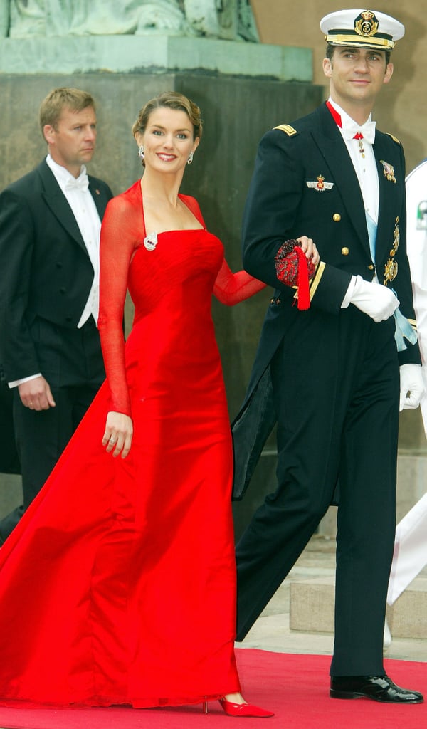 She wore an elegant red dress when the couple attended the wedding of Danish Crown Prince Frederik and Mary Donaldson in May 2004.