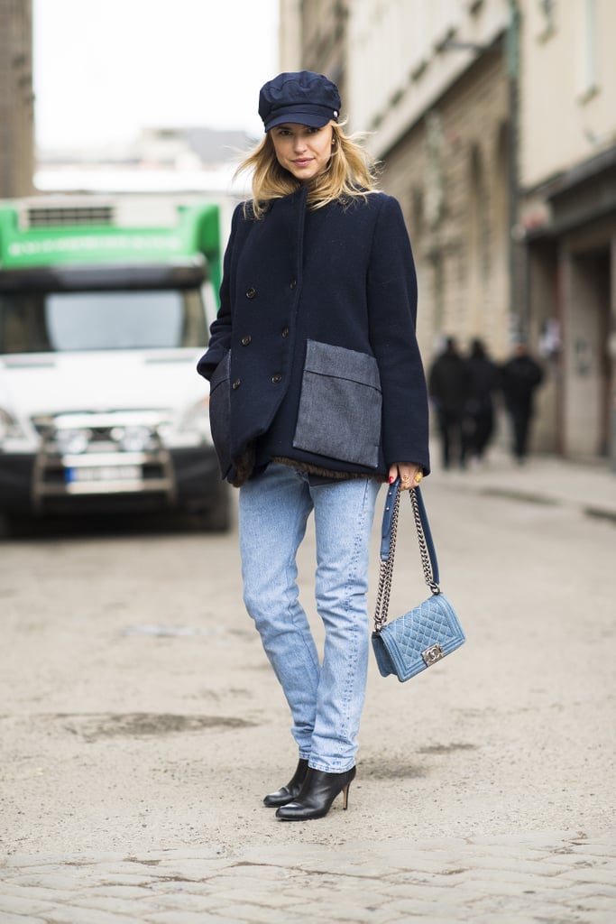 Her hat may say tomboy, but that Chanel bag says fashion darling. 
Source: Le 21ème | Adam Katz Sinding