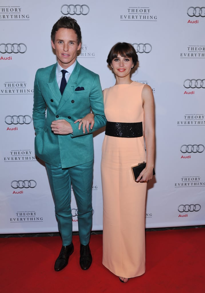 Eddie Redmayne and Felicity Jones made a colorful pair on the red carpet at the premiere of The Theory of Everything.