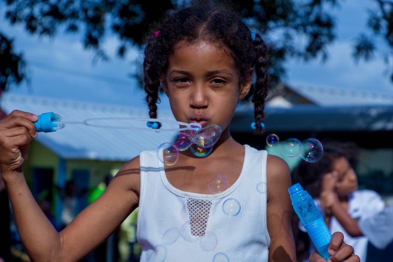 Blow bubbles.