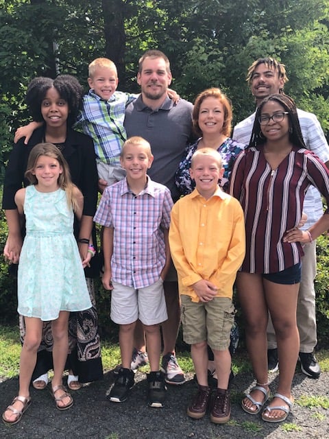 Raelyn with her husband Jarrett, her five children (Braiden, Janille, Isabella, Chase, and Ethan), and two goddaughters.