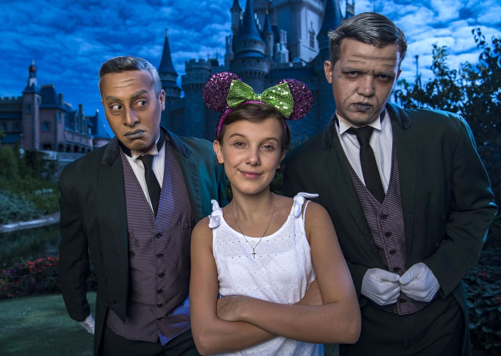 In October 2016, Millie Brown posed with two grave diggers from the Haunted Mansion ride at Magic Kingdom.