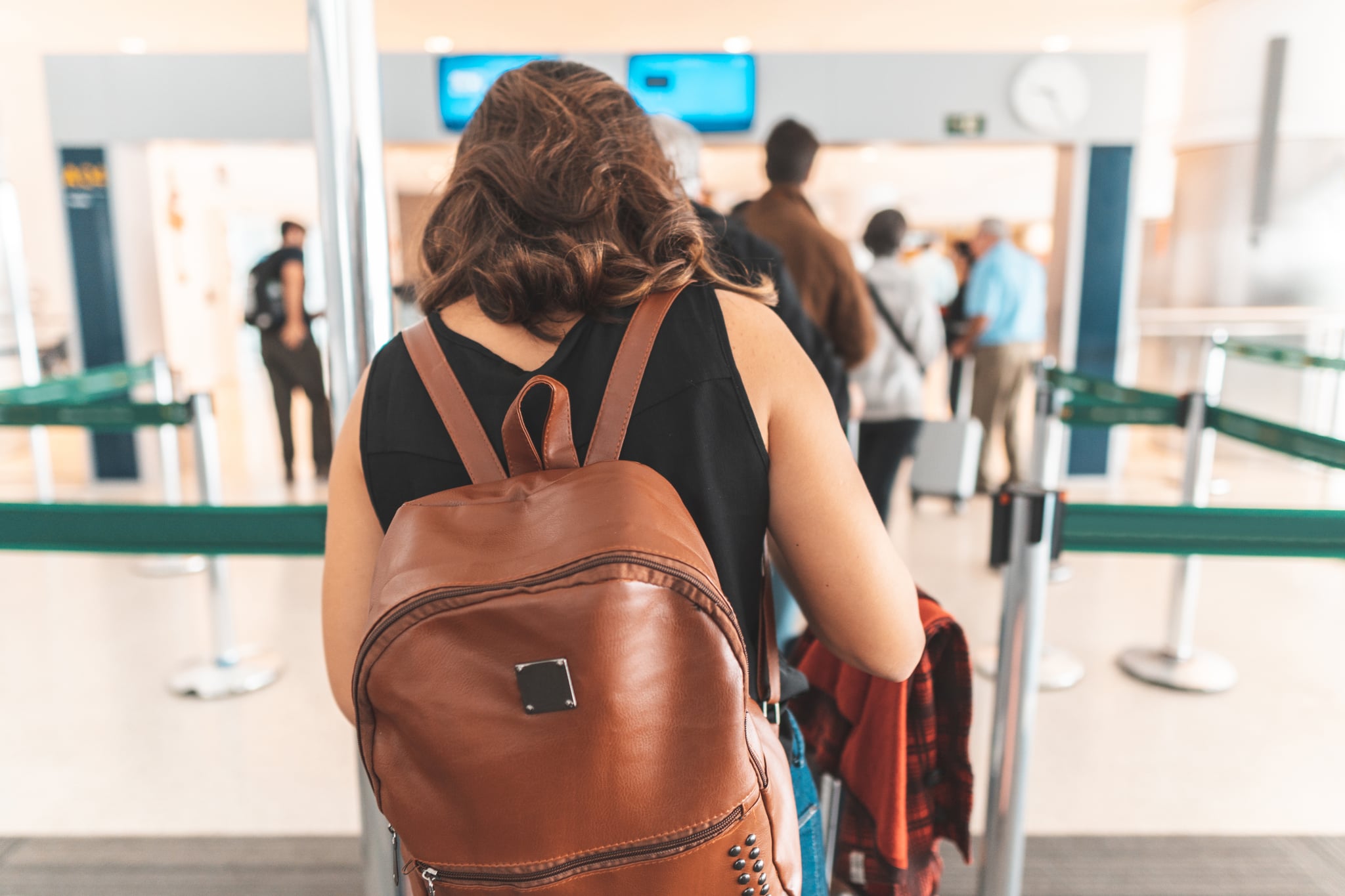 Woman Waiting In Security Line at Airport