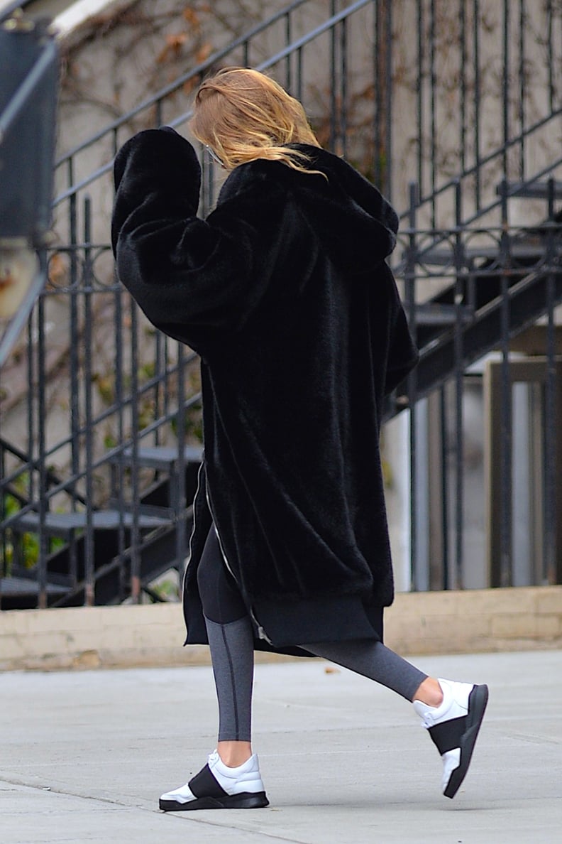 Gigi Brought the Same Black and White Color Palette to the Street With Two-Toned Trainers