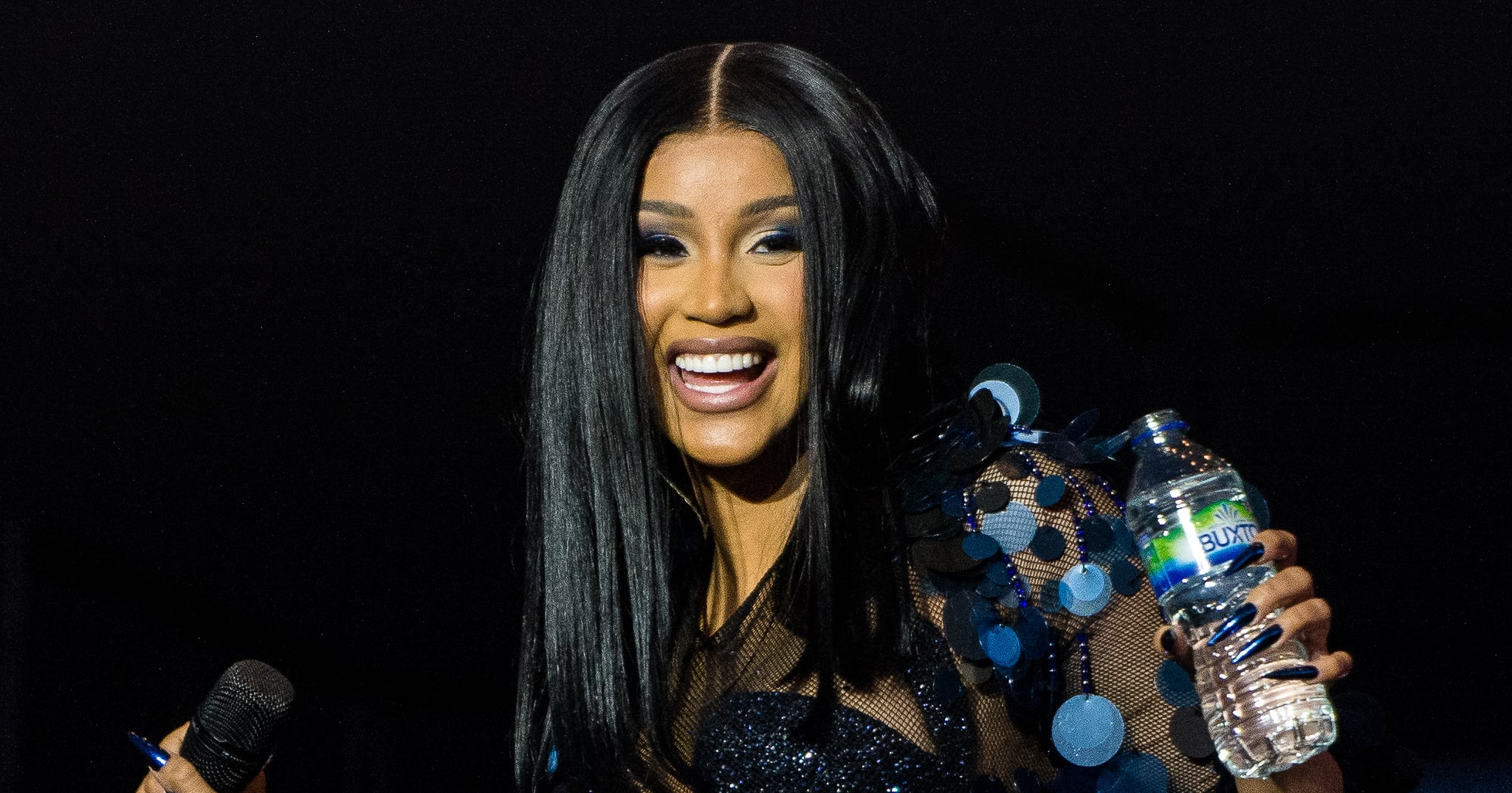 Cardi B Shows Off Her Butt Tattoos in a Plunging Lace-Up Catsuit