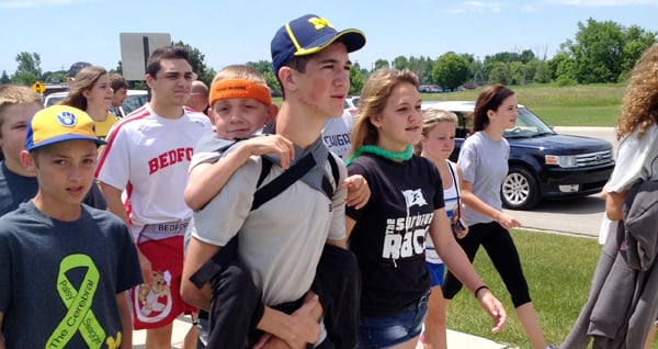 Teen Carries Brother For Cerebral Palsy Walk | PS Family