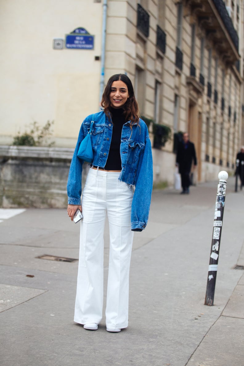 a tan crop top, tan wideleg pants, an oversized white shirt