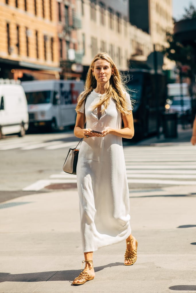 A cotton midi dress and gladiator sandals is a classic summer combination that stands the test of time.