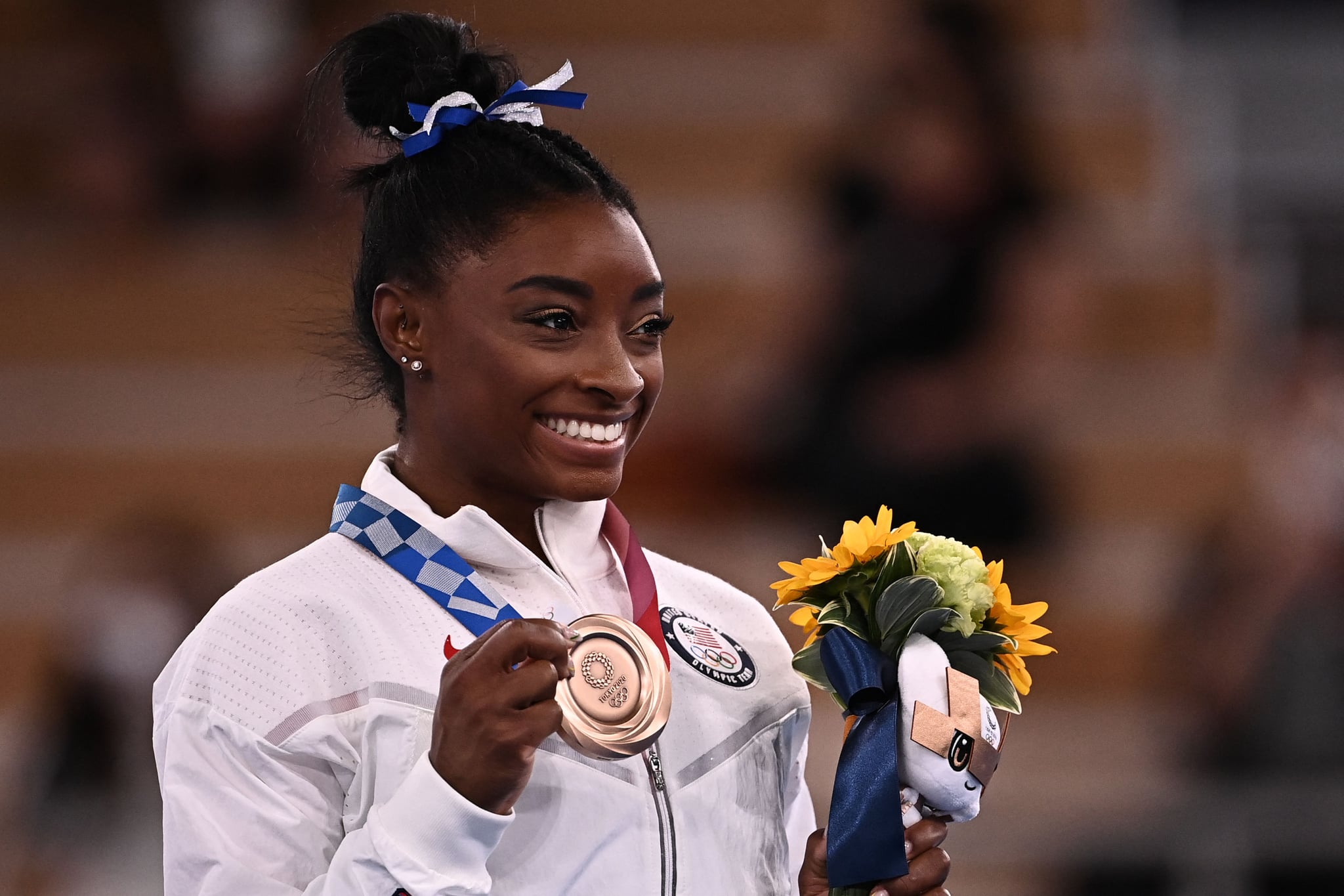 USA's Simone Biles poses with her bronze medal during the podium ceremony of the artistic gymnastics women's balance beam of the Tokyo 2020 Olympic Games at Ariake Gymnastics Centre in Tokyo on August 3, 2021. (Photo by Lionel BONAVENTURE / AFP) (Photo by LIONEL BONAVENTURE/AFP via Getty Images)