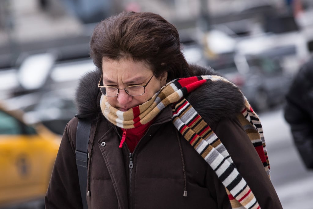 A woman braced herself against the chilly NYC winds.